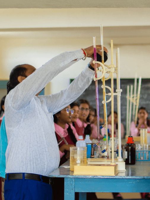 Image of teacher conducting experiment in lab