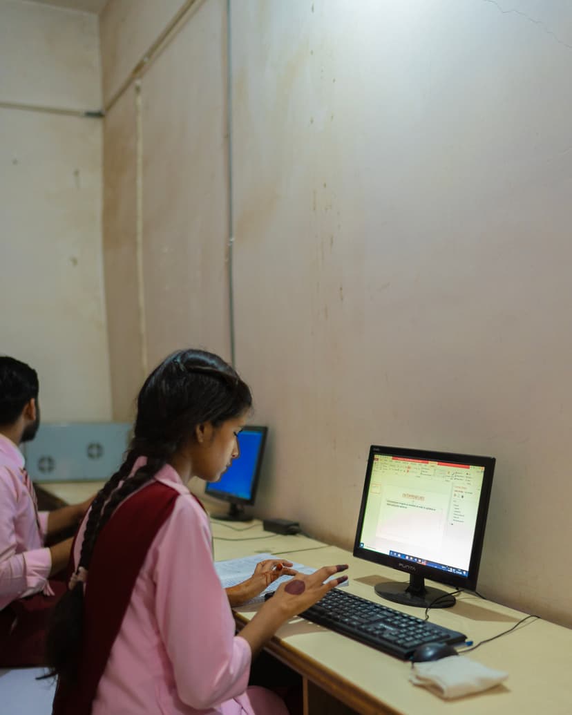 girl using computer in an computer lab of college